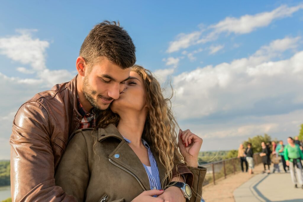 What Men View as a Perfect Casual Sex Partner 4 A loving couple embraces under a clear sky, showcasing romance and togetherness.